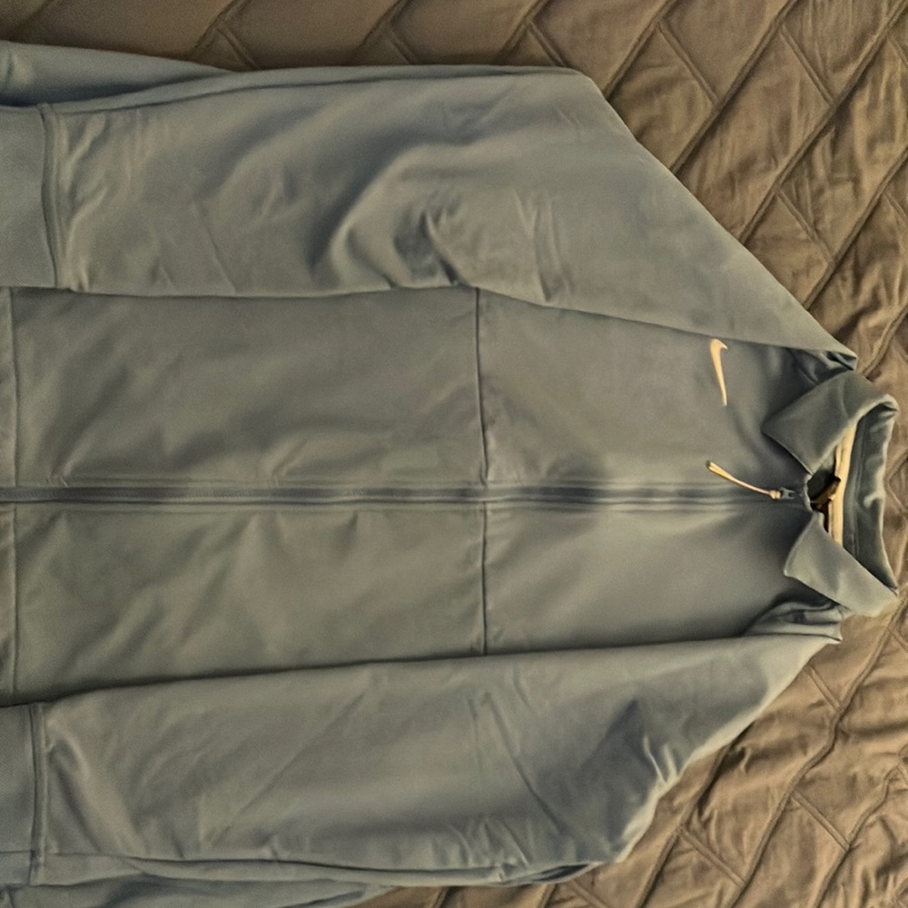 Selling a Nike quarter zip you can also wear for business purposes.